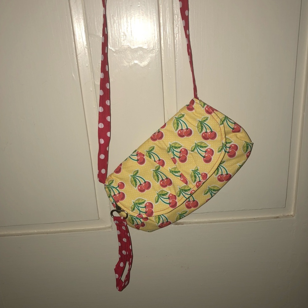 Cherry pocketbook with wristlet and crossbody.